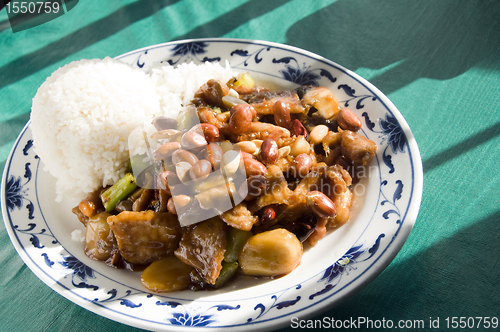 Image of Chinese food roast pork hot pepper sauce and peanuts