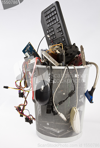 Image of electronic scrap in trash can