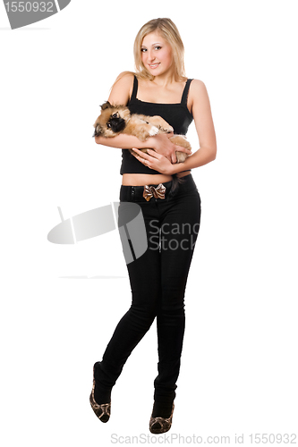 Image of Pretty blonde holding pekinese