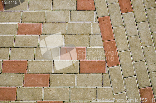 Image of City sidewalk lined with small tile background 