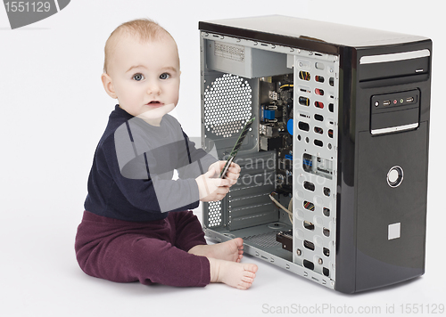 Image of young child with open computer