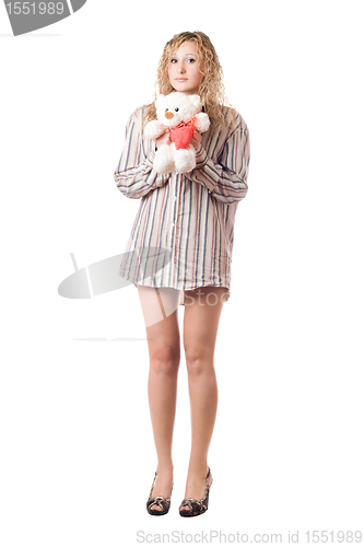 Image of Playful woman holding teddy bear