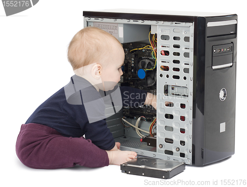 Image of young child with open computer