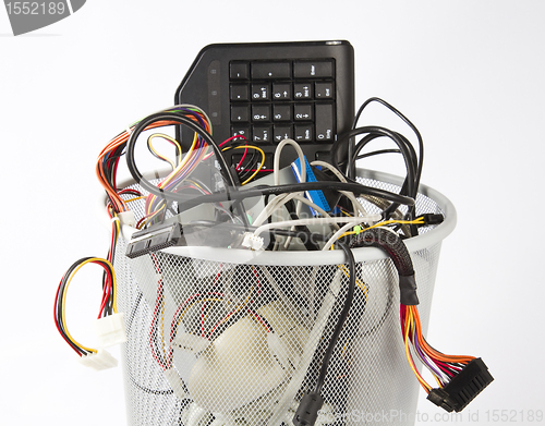 Image of electronic scrap in trash can