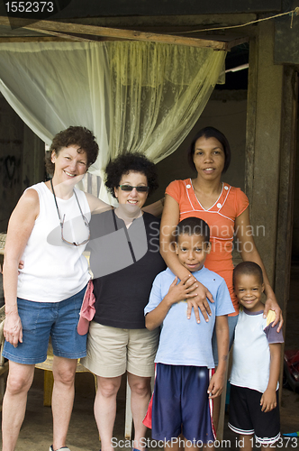 Image of white senior tourists with native mother sons family Corn Island