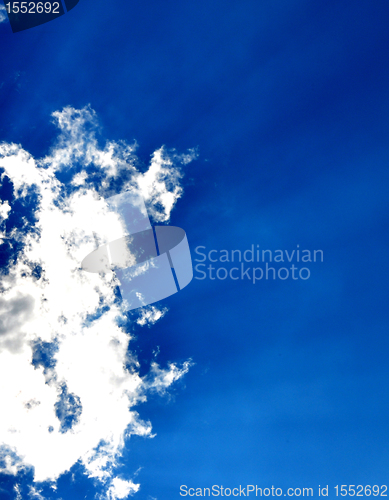 Image of Blue sky with clouds and sun rays
