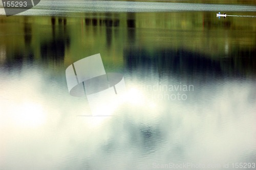 Image of canoe on abstract reflection