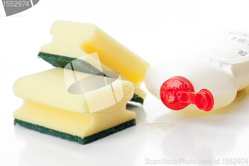 Image of Yellow kitchen sponges and bottle of dishwashing liquid