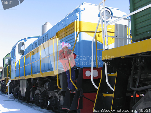 Image of Young girl on old  locomotive