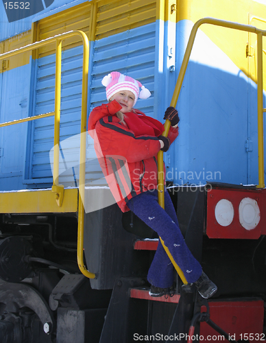 Image of Young girl on old  locomotive