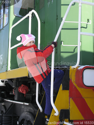 Image of Young girl on old  locomotive