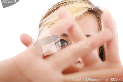 Image of blonde female hide her face behind her hand, keep away gesture, isolated on white background