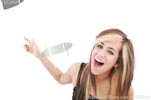 Image of Closeup of cheerful young woman pointing at something interesting over white background