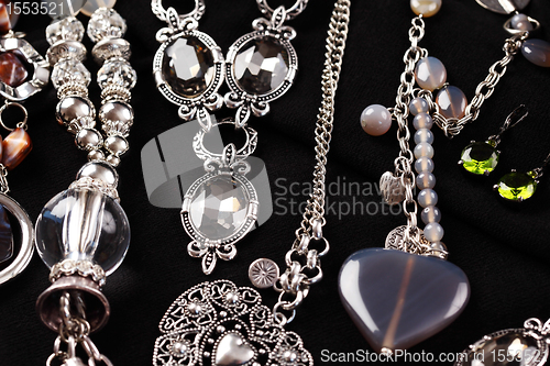 Image of Necklaces and accessories on black background