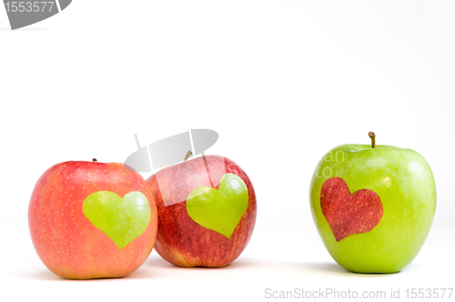 Image of three apples with hearts