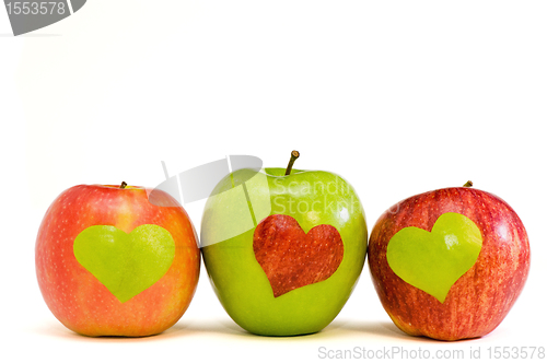 Image of three apples with hearts