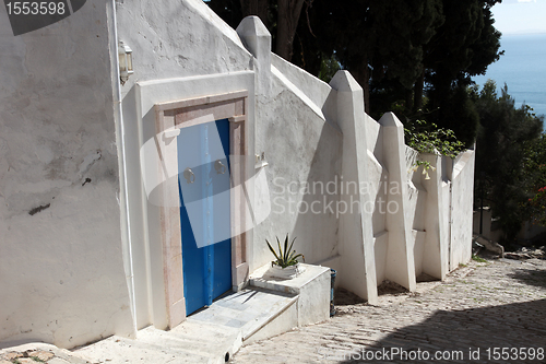 Image of Sidi Bou Said - typical building with white walls, blue doors and windows