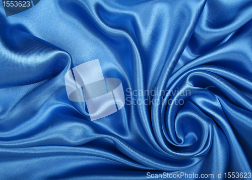 Image of Smooth elegant blue silk as background 