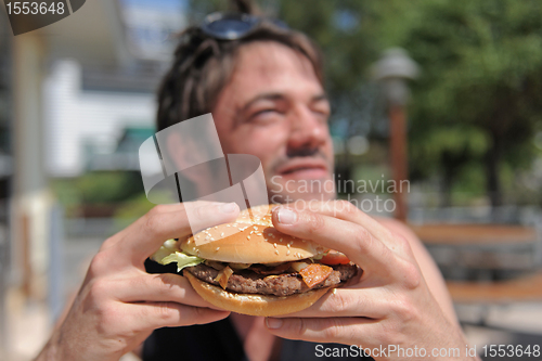 Image of man and hamburger