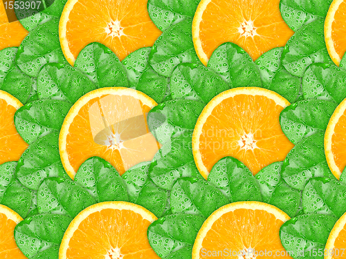 Image of Background of orange slices and green leaf