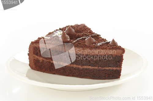 Image of chocolate cake slice on white plate