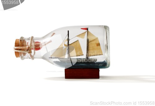 Image of Two-masted ship in a bottle isolated