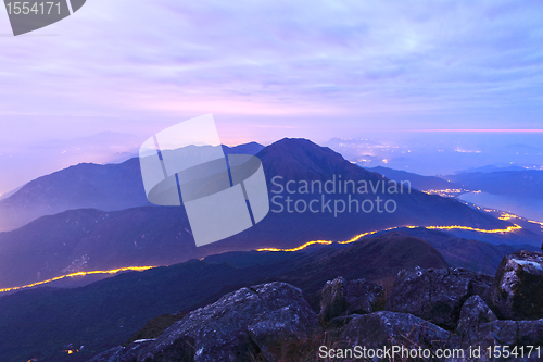 Image of mountain at night with road