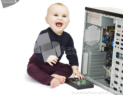Image of young child with open computer
