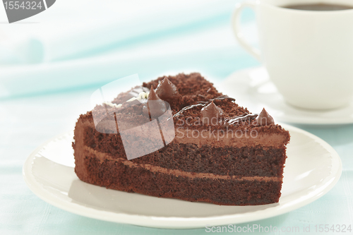 Image of chocolate cake slice on white plate