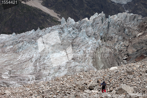 Image of Hiker on glacier moraine