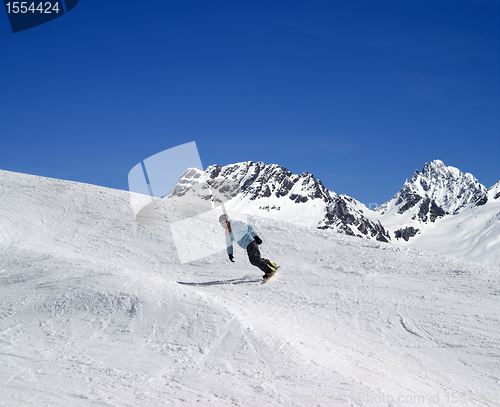 Image of Snowboarding in high mountains