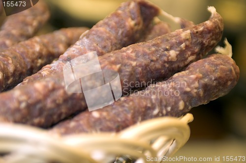 Image of sausage in wicker basket