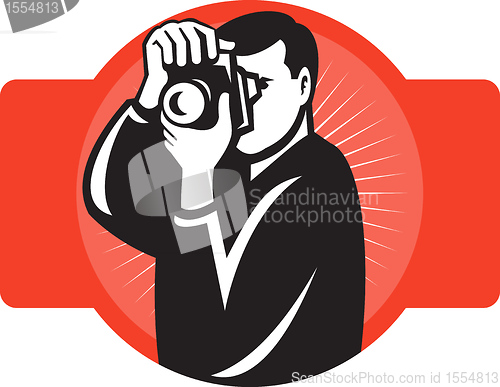 Image of photographer aiming slr camera front