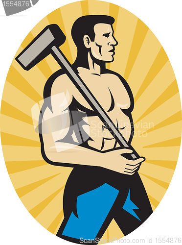 Image of worker with sledge hammer side view