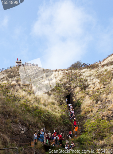 Image of Tourists walking to top of Waikiki crater