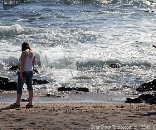 Image of Woman beachcomb on Glass Beach