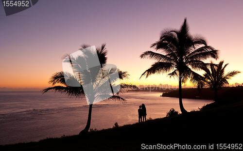Image of Couple watching sunrise in Kauai