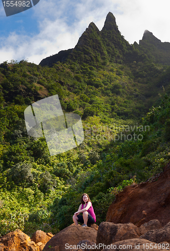 Image of Girl hiking Kalalau trail in Kauai