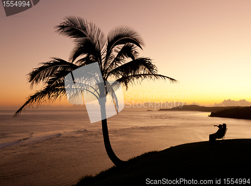 Image of Couple watching sunrise in Kauai