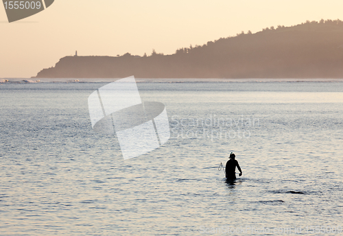 Image of Misty sunrise with snorkler