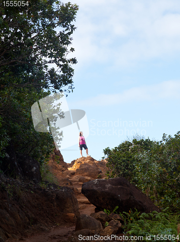 Image of Girl hiking Kalalau trail in Kauai