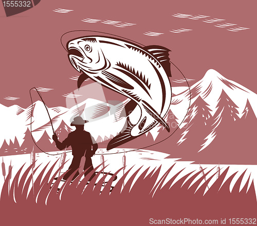 Image of fly fisherman catching jumping trout