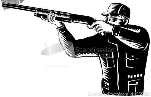 Image of hunter aiming shotgun rifle