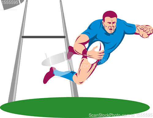Image of rugby player diving to score a try