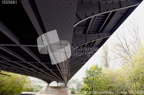 Image of Metal construction of large bridge over river 