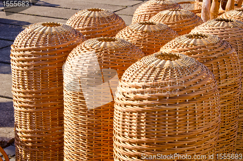Image of Wicker wooden handmade baskets sold in market fair 