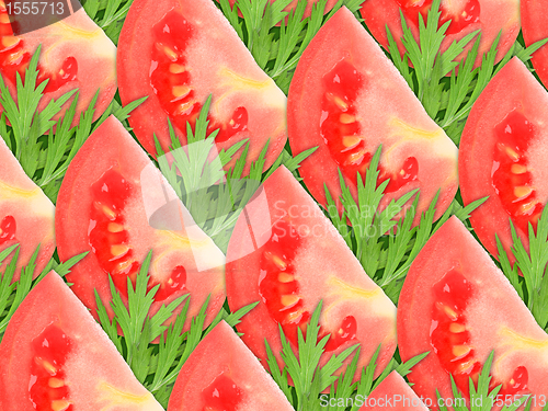 Image of background of red tomatoes and green leaf