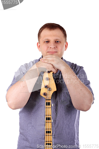 Image of Young man playing guitar
