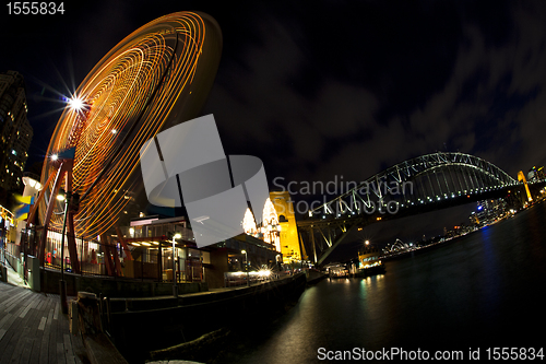 Image of Ferris wheel in the front of Sydney Harbour Bridge