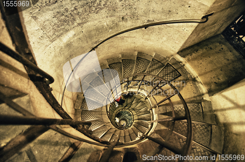 Image of Spiral Staircase with People Moving